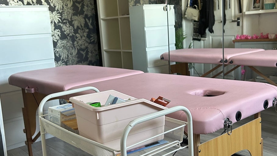 Pink massage tables at Makeup By Milana, Hemel Hempstead, England, GB, offering relaxing wellness services.