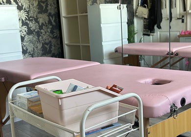 Pink massage tables at Makeup By Milana, Hemel Hempstead, England, GB, offering relaxing wellness services.