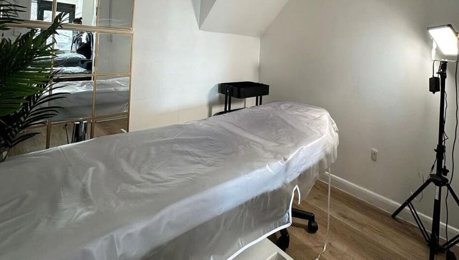 Relaxing treatment room at Stript Aesthetics Clinic Limited, Orpington, England, GB, featuring a cozy setup.