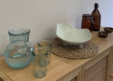 Natural decor setup at WildRose Natural Beauty Studio, Fladbury, England, GB, with jars and glasses.