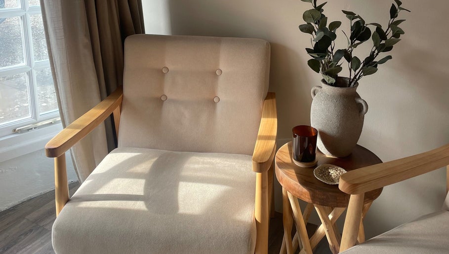 Serene seating area with wooden chairs at WildRose, Fladbury, England, GB.