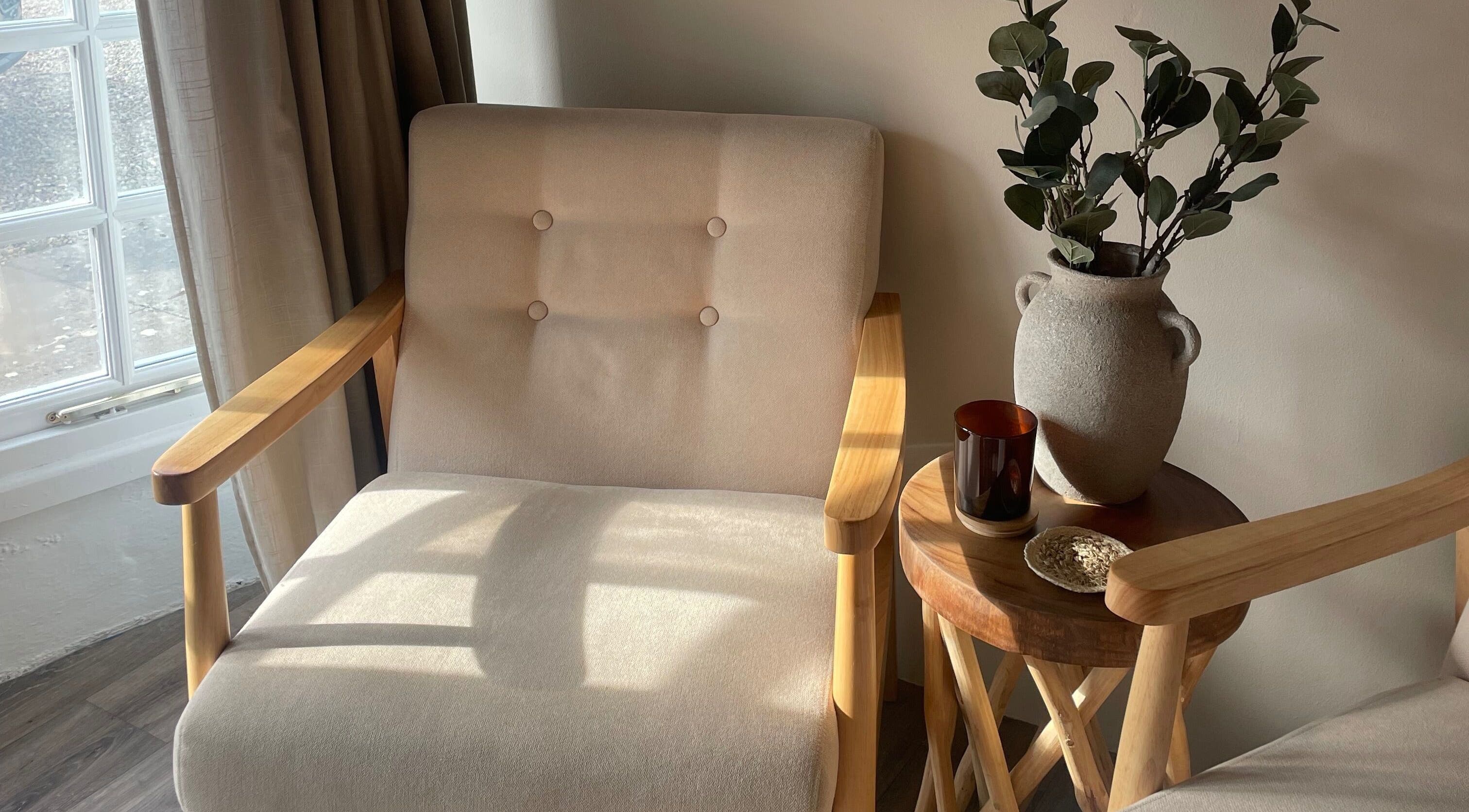 Serene seating area with wooden chairs at WildRose, Fladbury, England, GB.