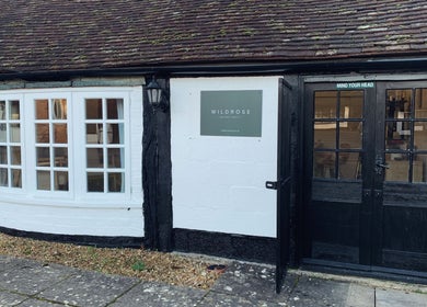 Front view of WildRose in Fladbury, England, GB showcasing a quaint black and white entrance.