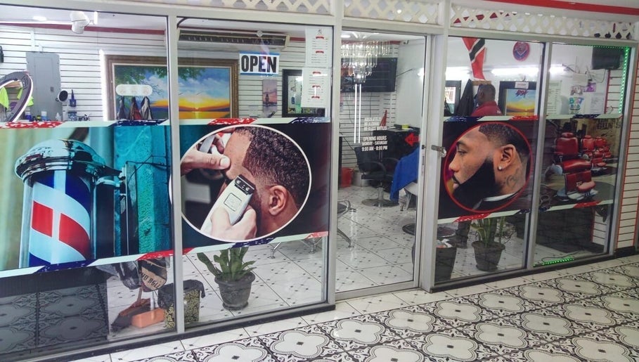 Entrance of Red Beard Barbering Studio in Port of Spain, showcasing vibrant barber-themed graphics.