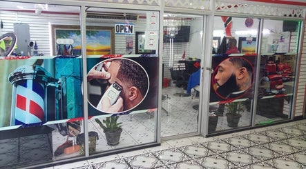 Entrance of Red Beard Barbering Studio in Port of Spain, showcasing vibrant barber-themed graphics.