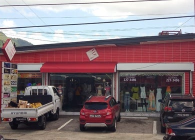 Entrance of Red Beard Barbering Studio in Port of Spain, TT, featuring a modern storefront design.