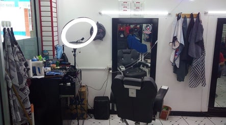 Interior of Red Beard Barbering Studio in Port of Spain, TT, featuring barber chair and styling tools.