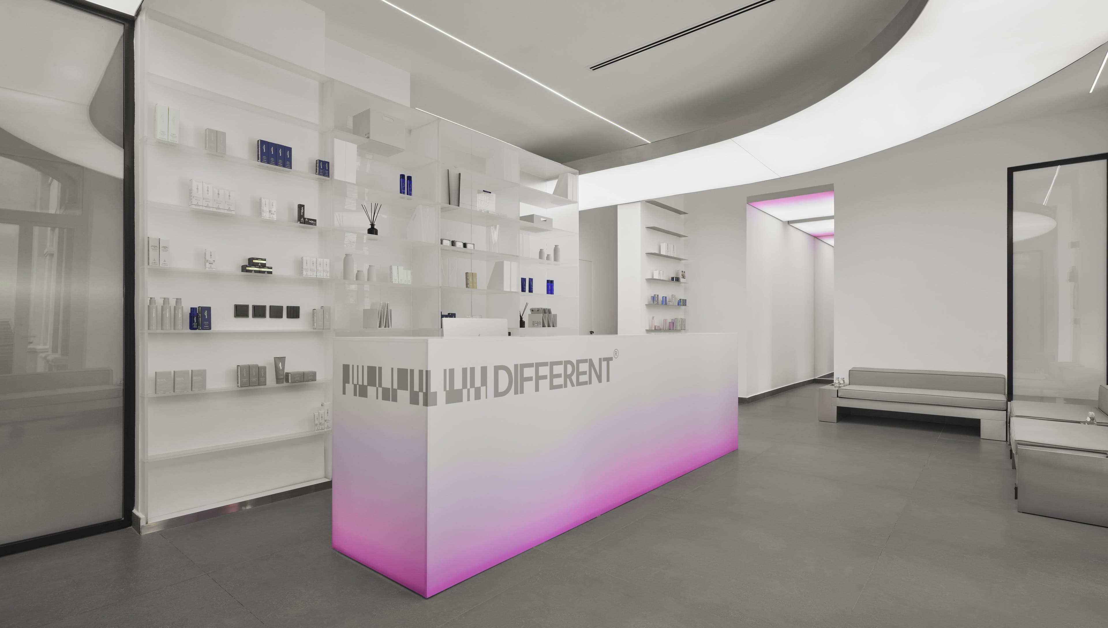Sleek reception area of DIFFERENT Clinic in Abu Dhabi, AE showcasing modern design and lighting.