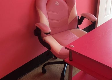 Pink office chair and desk at Ariche Beauty in Roseau, Saint Paul Parish, DM.