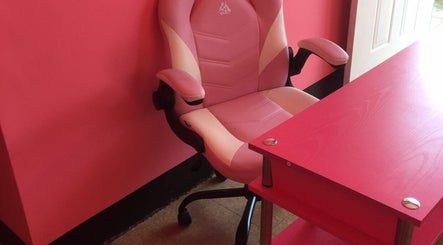 Pink office chair and desk at Ariche Beauty in Roseau, Saint Paul Parish, DM.