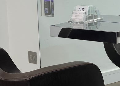 Sleek styling chair and mirror at G R Hair Studio, Truro, England, GB. Modern design for premium hair services.