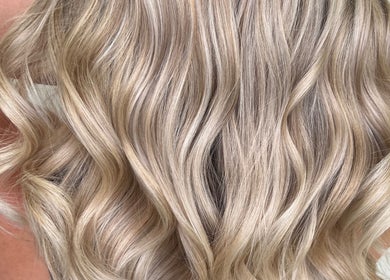 Flowing blonde waves styled at G R Hair Studio, Truro, England, GB.