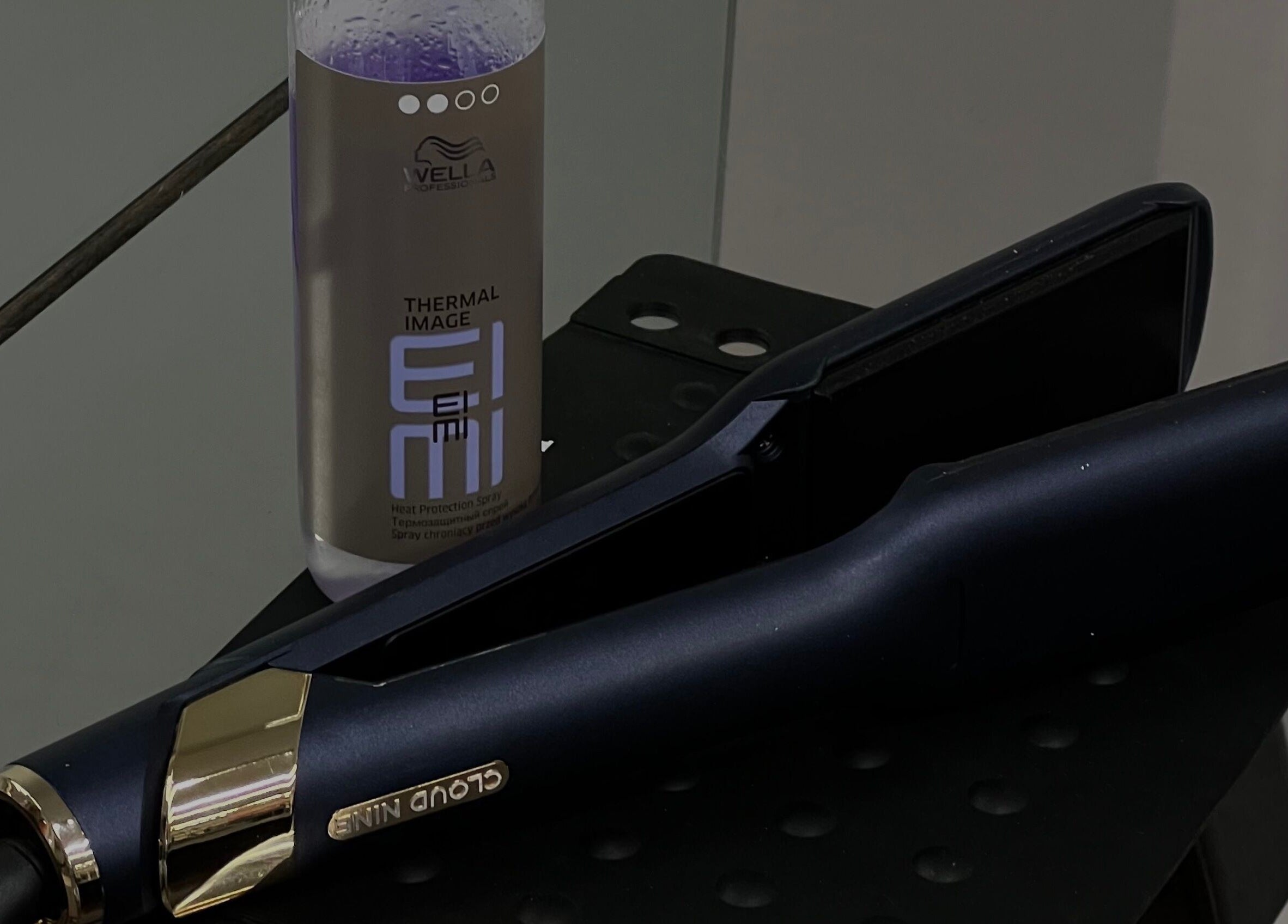 Professional hair styling tools at G R Hair Studio, Truro, England, GB, featuring heat protection spray.