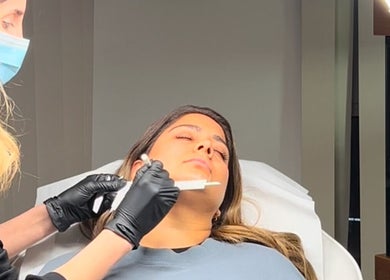 Beauty treatment at Aesthetixsbysarah Silkcorps Ltd, Wembley, England, GB. Aesthetician performing a precise procedure.