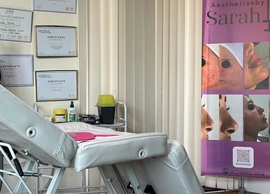 Aesthetixsbysarah Silkcorps Ltd treatment room in Wembley, England, GB showcasing certificates and care products.