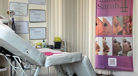Aesthetixsbysarah Silkcorps Ltd treatment room in Wembley, England, GB showcasing certificates and care products.