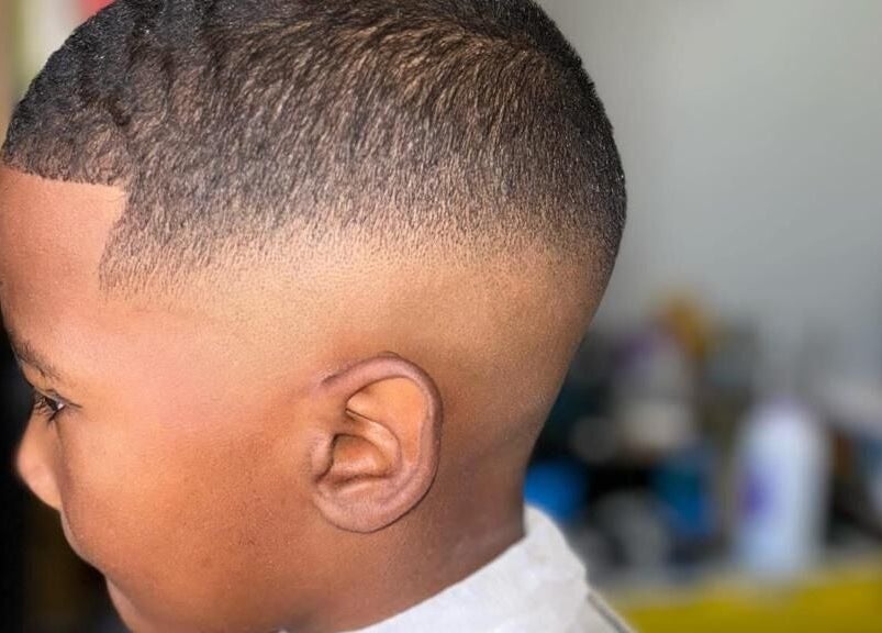 Crisp fade haircut at Incredible Haircuts, Stellenbosch, Western Cape, ZA showcasing expert barber skills.