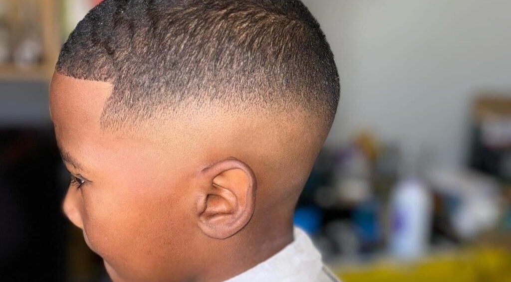 Crisp fade haircut at Incredible Haircuts, Stellenbosch, Western Cape, ZA showcasing expert barber skills.