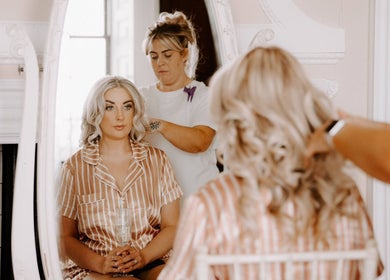 Client receiving hair styling at Clair Vanes Hair, Bilston, England, GB salon mirror scene.