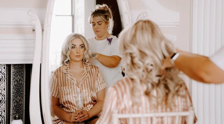 Client receiving hair styling at Clair Vanes Hair, Bilston, England, GB salon mirror scene.