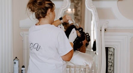 Hairstylist working on a client at Clair Vanes Hair, Bilston, England, GB.