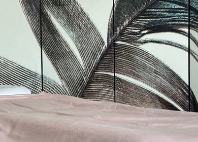Elegant spa bed at By Atinem, Capelle Aan Den Ijssel, Zuid-Holland, NL with artistic wall design.