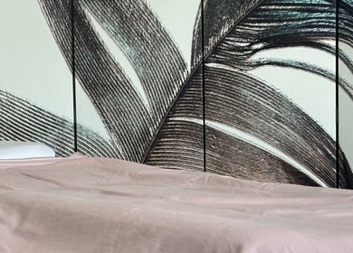 Relaxing treatment bed at By Atinem, Capelle Aan Den Ijssel, Zuid-Holland, NL, with calming wall art.