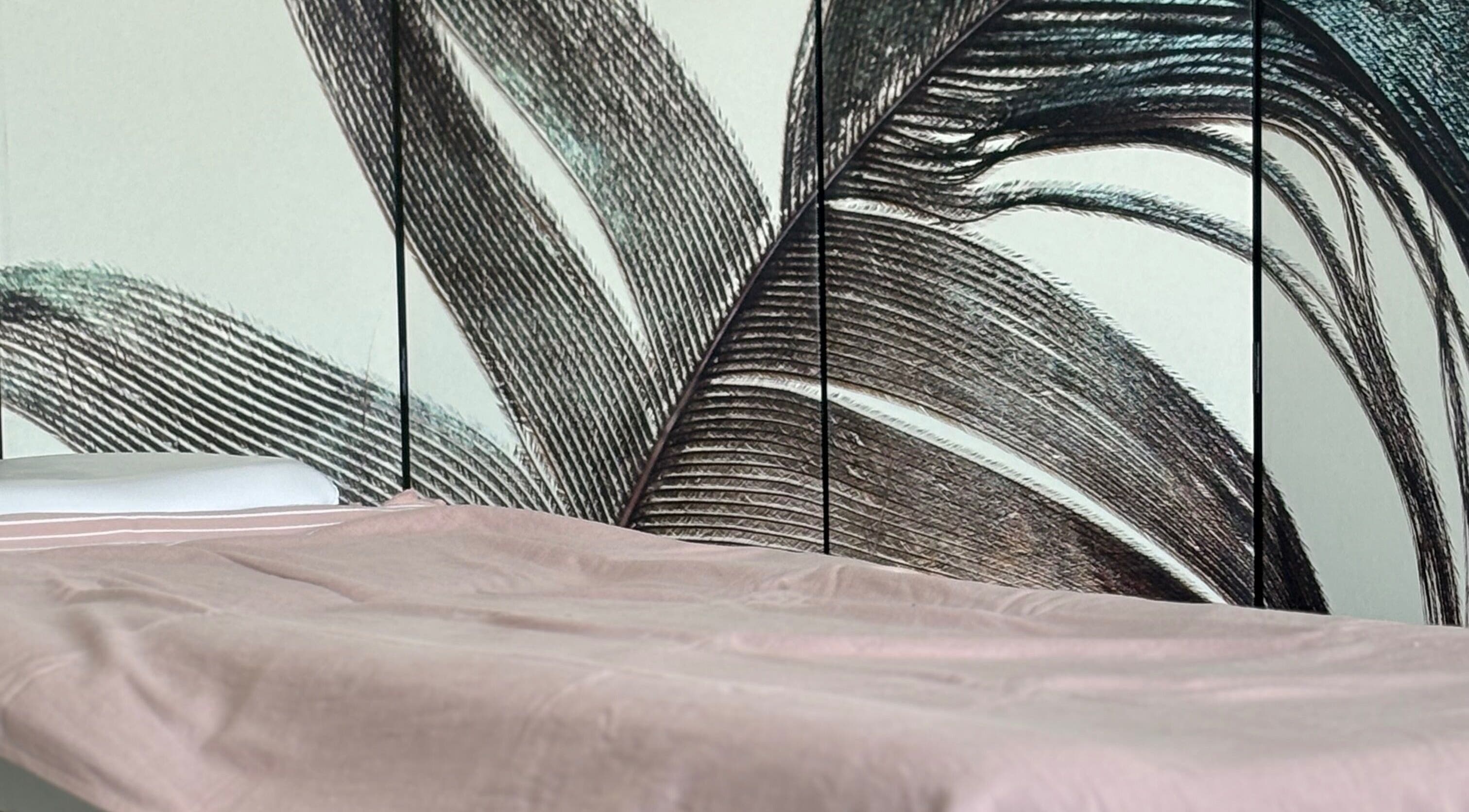 Relaxing treatment bed at By Atinem, Capelle Aan Den Ijssel, Zuid-Holland, NL, with calming wall art.