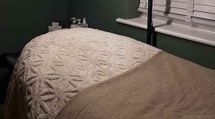 Comfortable treatment bed at DANA Skin & Aesthetics in Ripon, England, GB, ready for a soothing session.