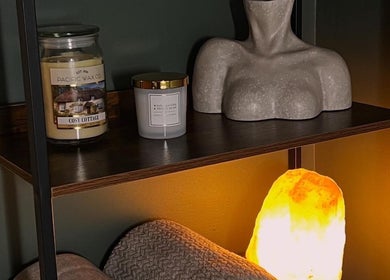 Elegant shelf at DANA Skin & Aesthetics, Ripon, England, GB with candles and decor for a calming ambiance.