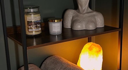 Elegant shelf at DANA Skin & Aesthetics, Ripon, England, GB with candles and decor for a calming ambiance.