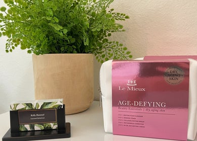Le Mieux age-defying products at Refresh Skin, Carlsbad, California, US displayed with a green plant.