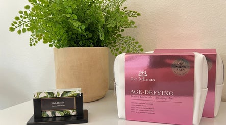 Le Mieux age-defying products at Refresh Skin, Carlsbad, California, US displayed with a green plant.