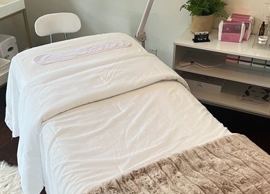 Relaxing treatment bed at Refresh Skin in Carlsbad, California, US, showcasing a serene and inviting ambiance.