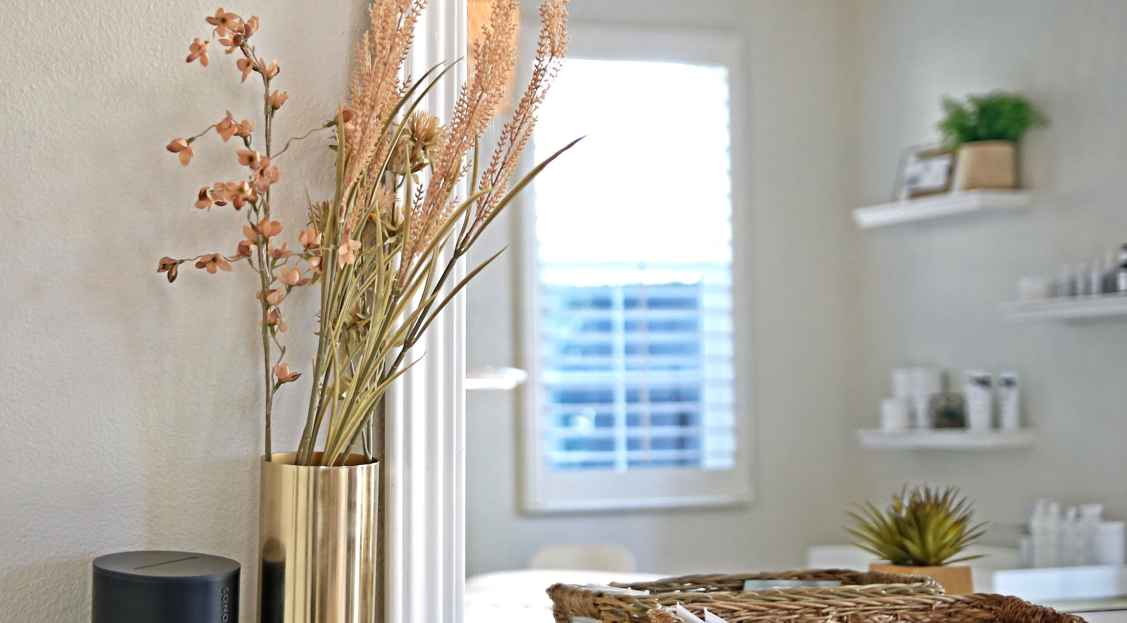 Elegant decor at Refresh Skin, Carlsbad, California, US, featuring a stylish vase with dried flowers.