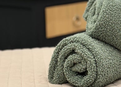 Soft green towels at The Beauty Feel With Iryna in Redruth, England, GB, enhancing spa ambiance.