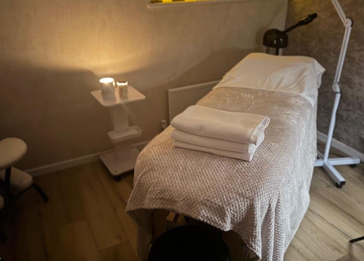 Spa treatment room at K&S Beauty & Aesthetics, Redditch, England, GB, with a cozy massage table and soft lighting.