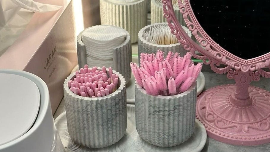 Pink beauty tools and mirror at Sophisticated lash lounge, Ponthir, Wales, GB. Elegance meets functionality.