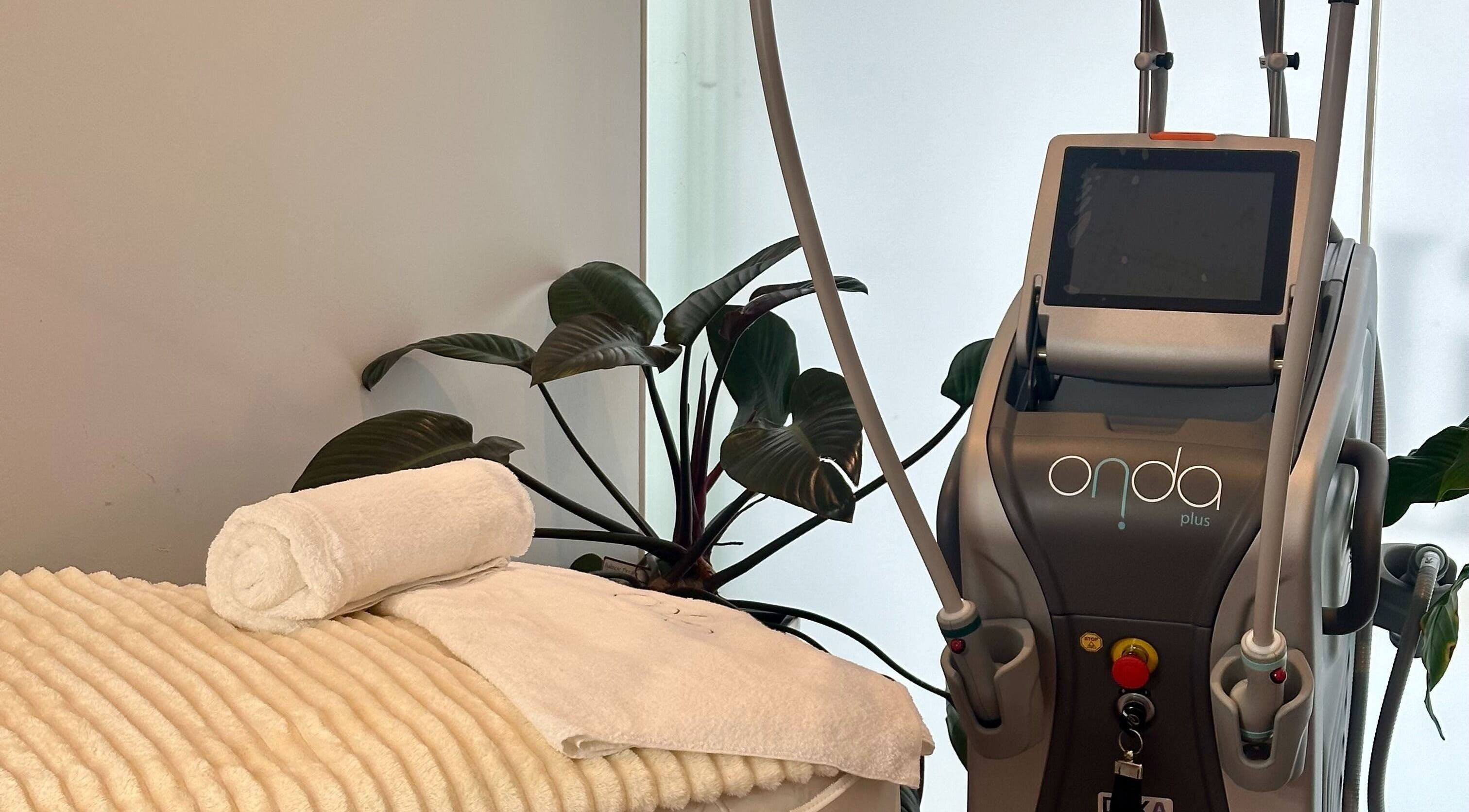 Modern treatment room at Mojo Cosmetic Clinic, Neutral Bay, New South Wales, AU featuring Onda Plus machine.