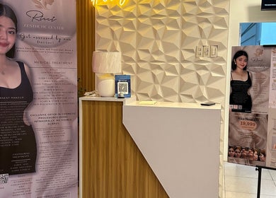 Reception area with banners at Ricci Aesthetic Center, Cainta, Calabarzon, PH showcasing beauty treatments.