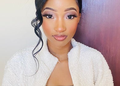 A woman with elegant makeup at KAYLUX BEAUTY SALON, Kimberley, Northern Cape, ZA.
