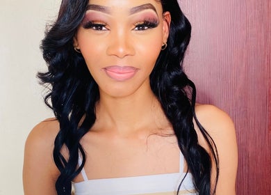Client with flawless makeup at KAYLUX BEAUTY SALON in Kimberley, Northern Cape, ZA.
