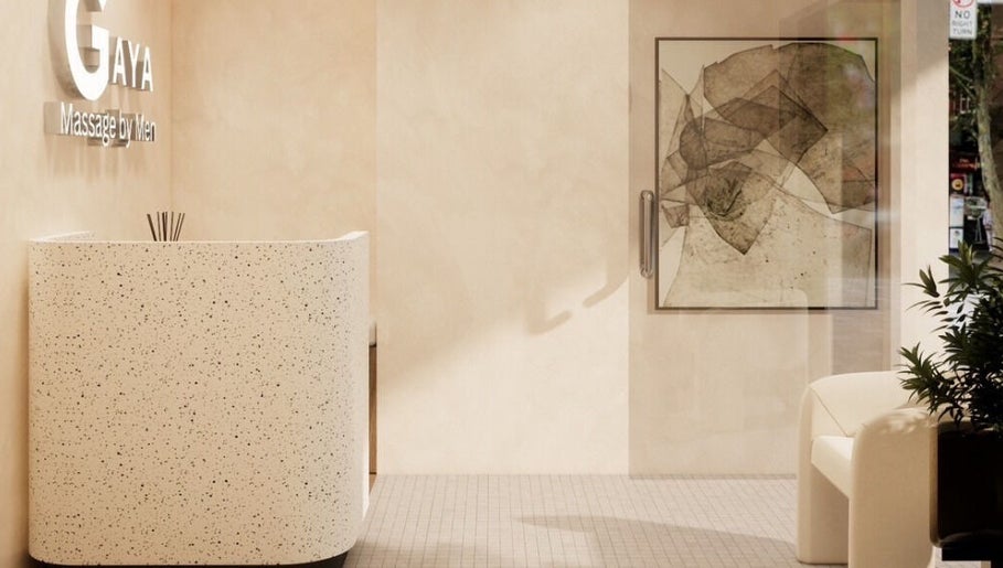 Modern reception area at Gaya Massage, Darlinghurst, New South Wales, AU with plants and abstract art.