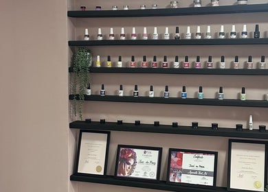 Nail polish display and certificates at Alae Aesthetics & Cosmetics, Gqeberha, Eastern Cape, ZA.