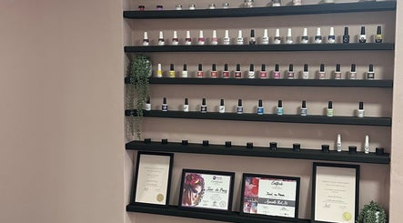Nail polish display and certificates at Alae Aesthetics & Cosmetics, Gqeberha, Eastern Cape, ZA.