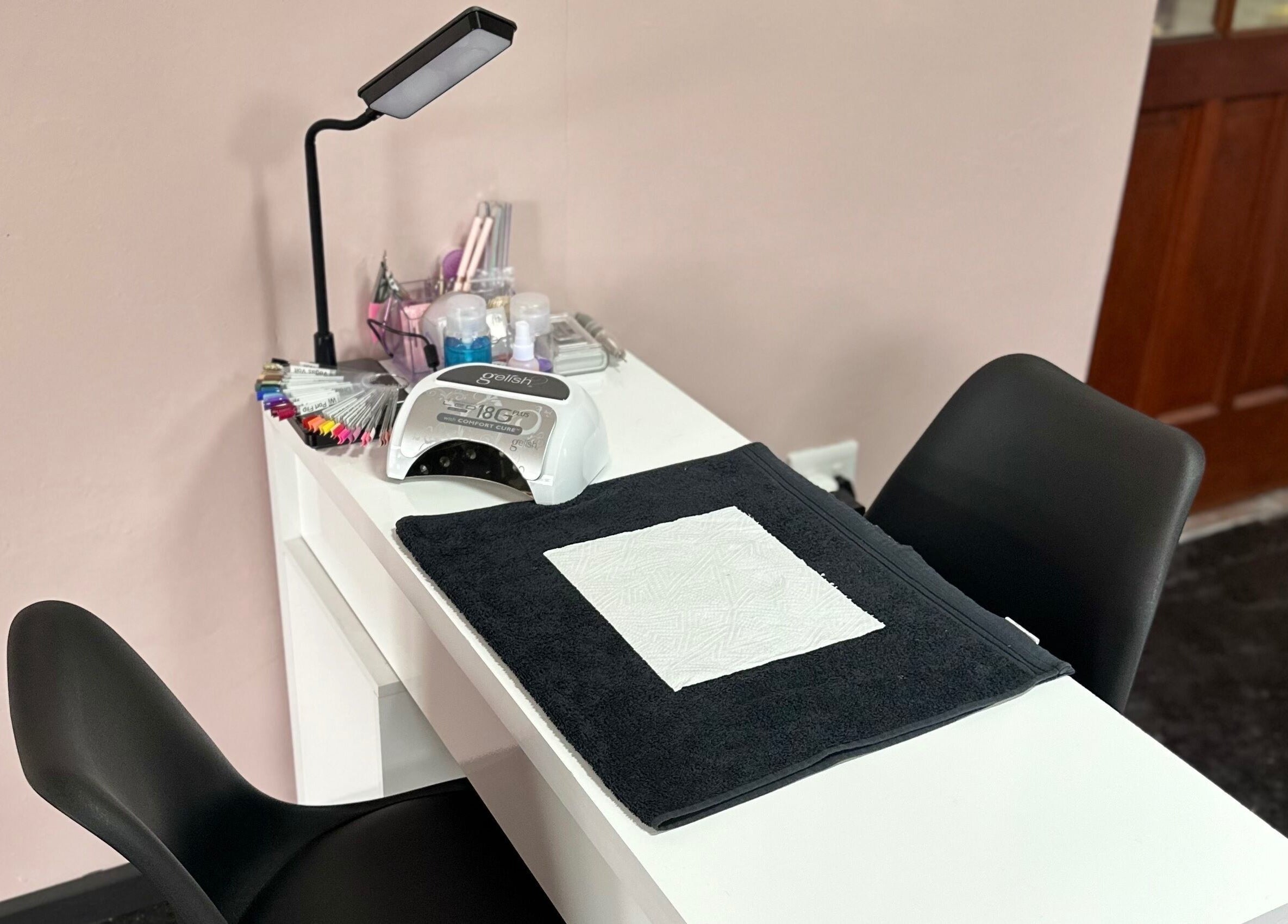 Professional nail station at Alae Aesthetics & Cosmetics in Gqeberha, Eastern Cape, ZA. Elegant and well-equipped.