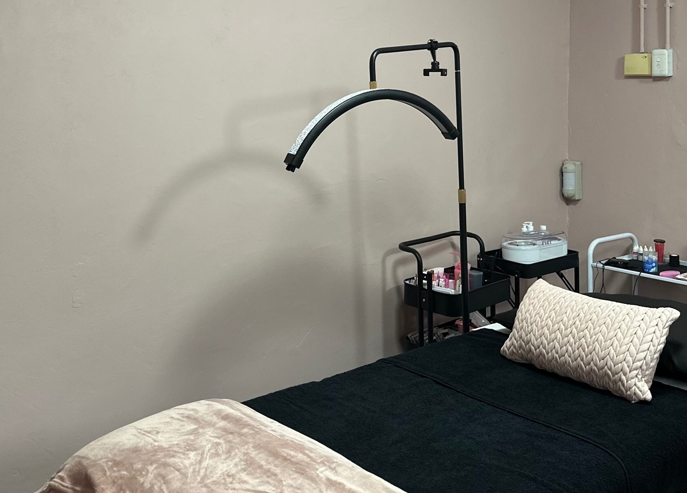 Calm treatment room at Alae Aesthetics & Cosmetics in Gqeberha, Eastern Cape, ZA, featuring a plush bed.