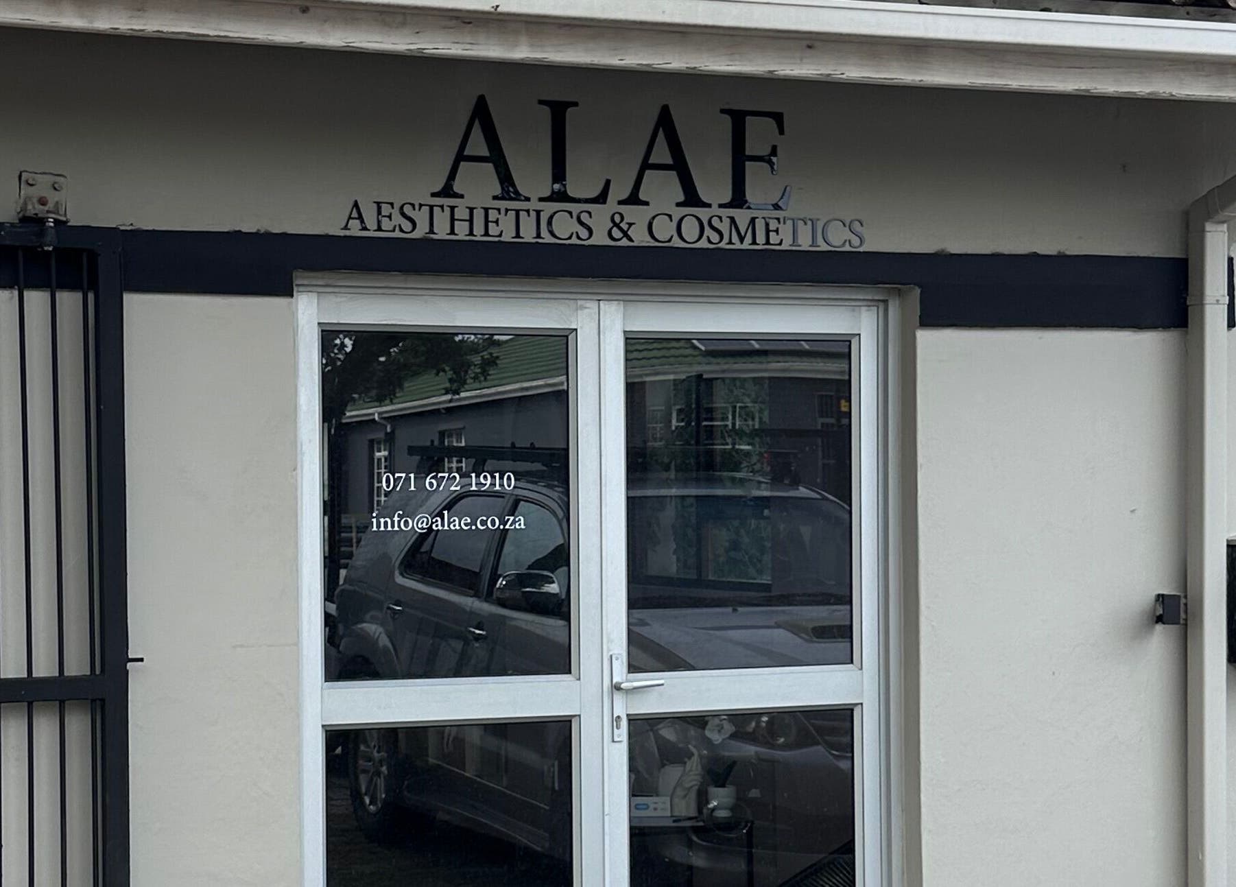 Entrance of Alae Aesthetics & Cosmetics in Gqeberha, Eastern Cape, ZA showcasing sleek design.