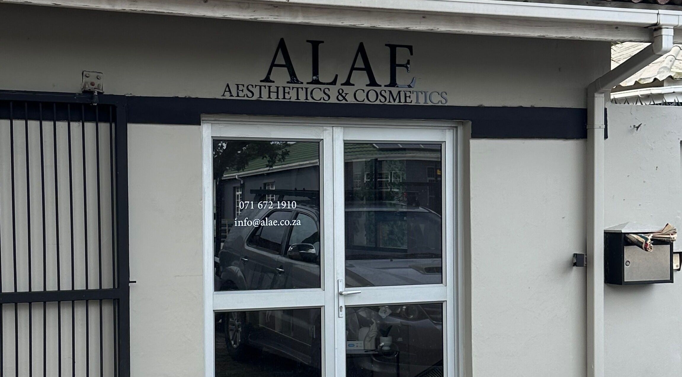 Entrance of Alae Aesthetics & Cosmetics in Gqeberha, Eastern Cape, ZA showcasing sleek design.
