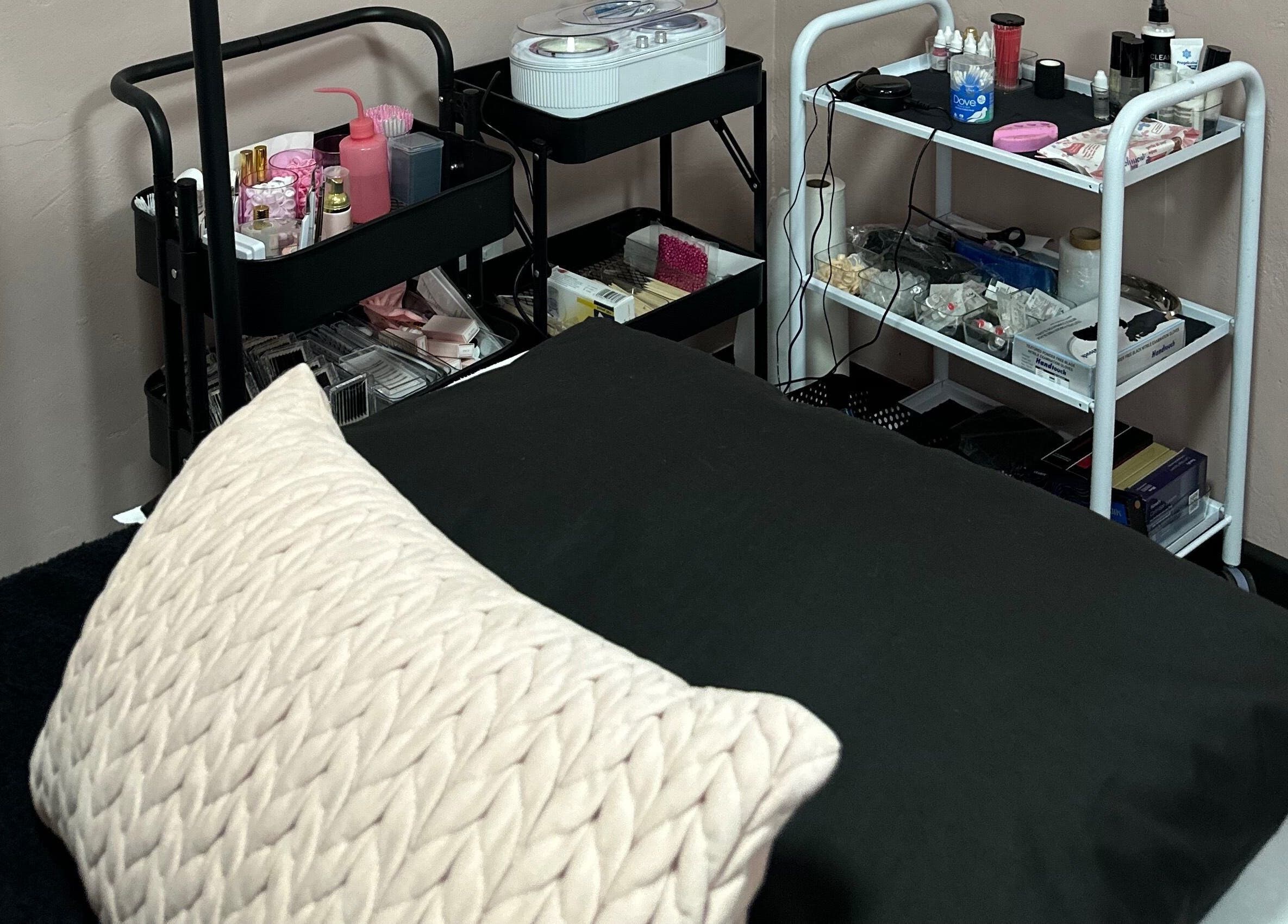 Cozy treatment room at Alae Aesthetics & Cosmetics, Gqeberha, Eastern Cape, ZA. Beauty supplies neatly organized.